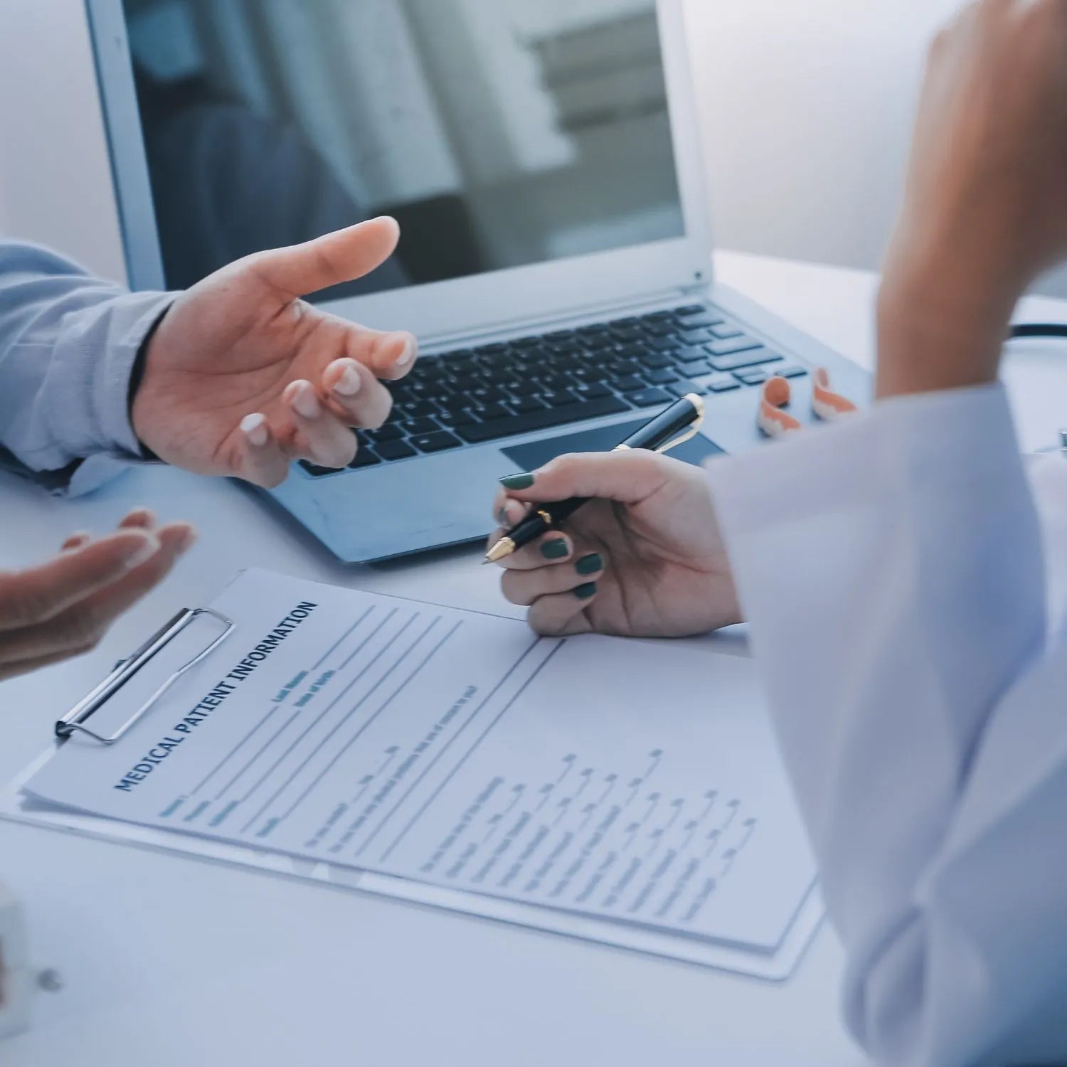 doctor going through medical questionnaire with a patient