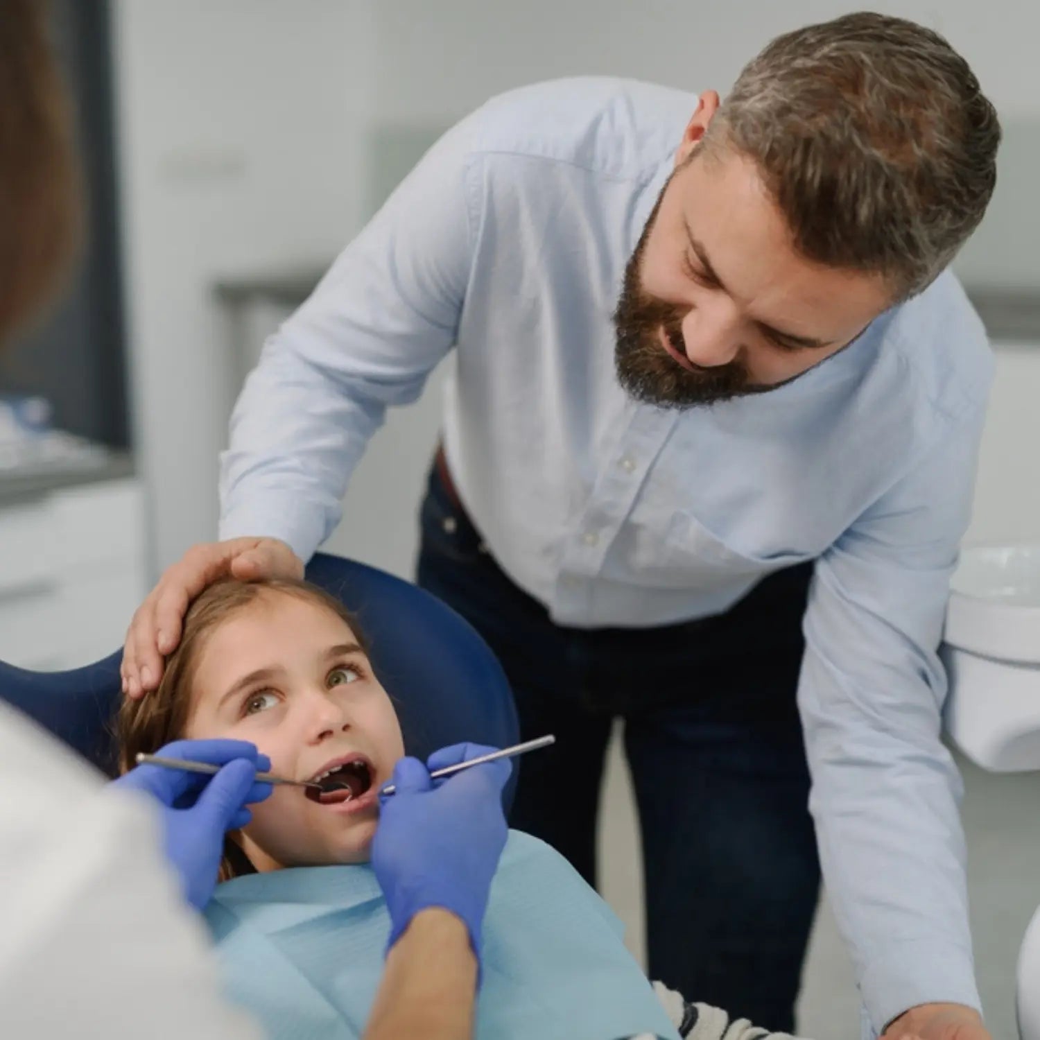 Dental examination with an orthodontist in a clinical setting
