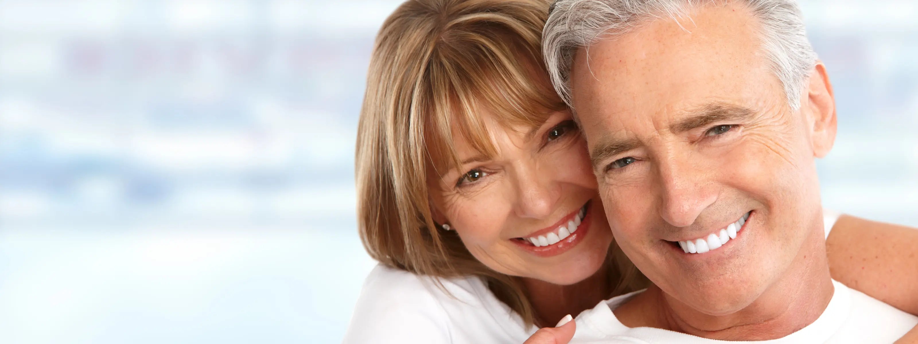 close up mature couple smiling , blur background