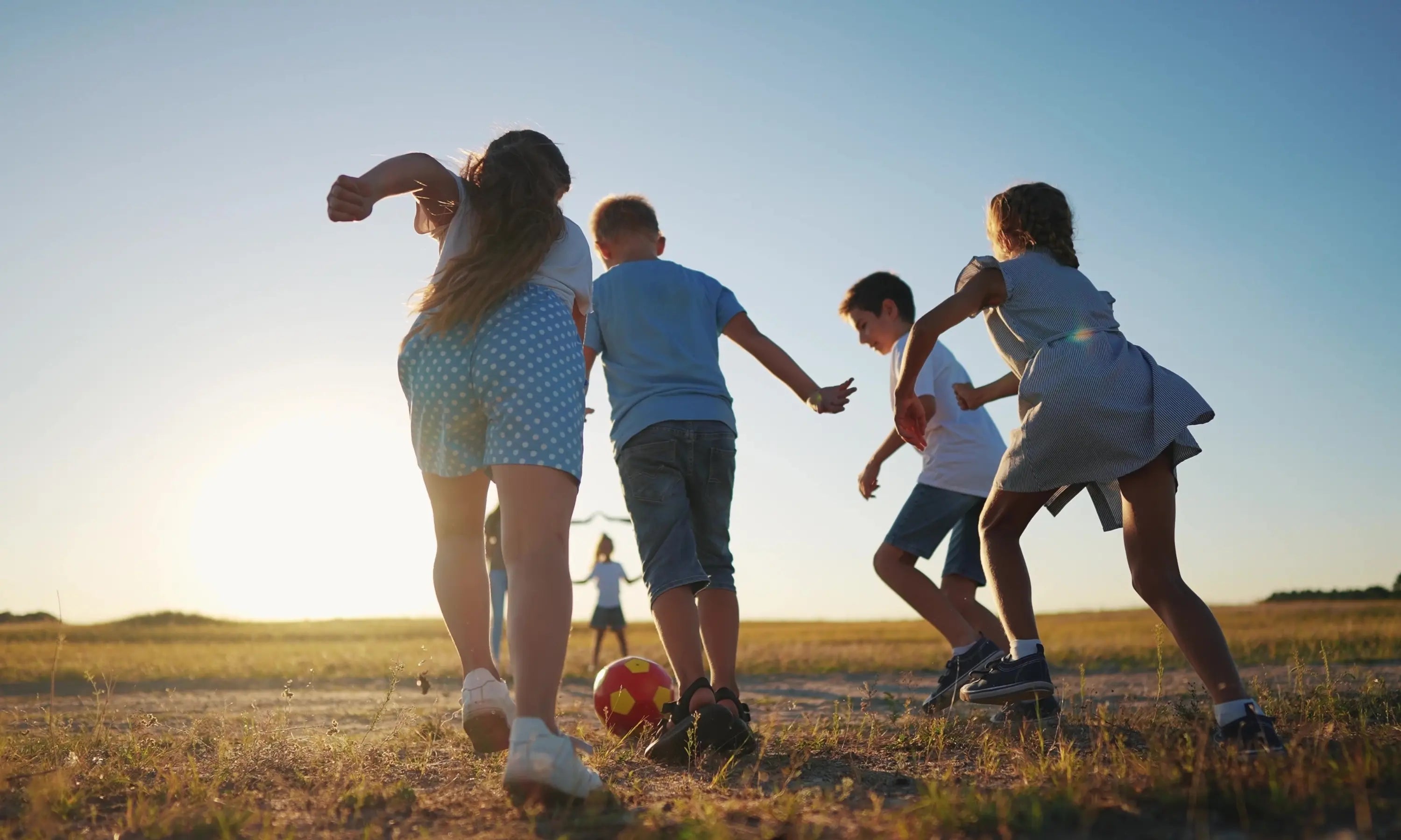 group of children playing with a ball