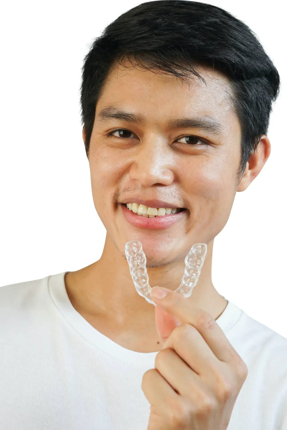 young asian teenager smiling holding his invisalign tray