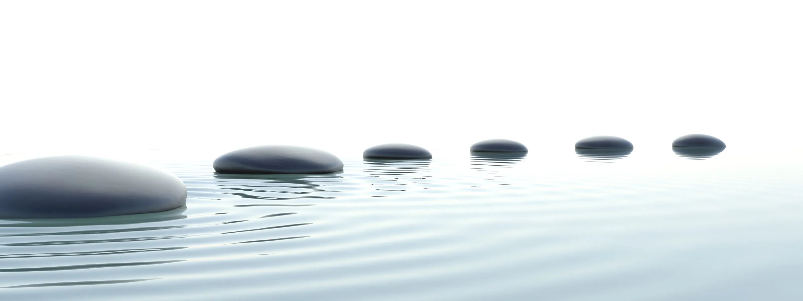zen  series of stones on surface of water