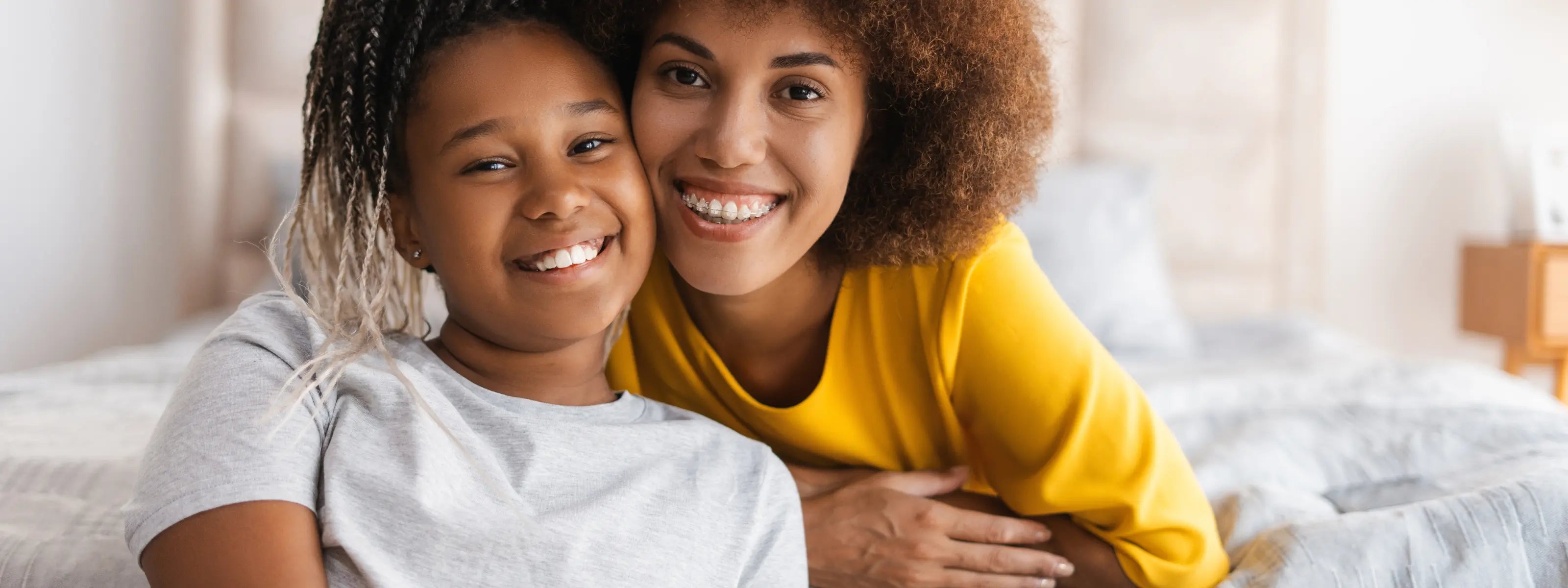 woman with her child wearing fixed braces 