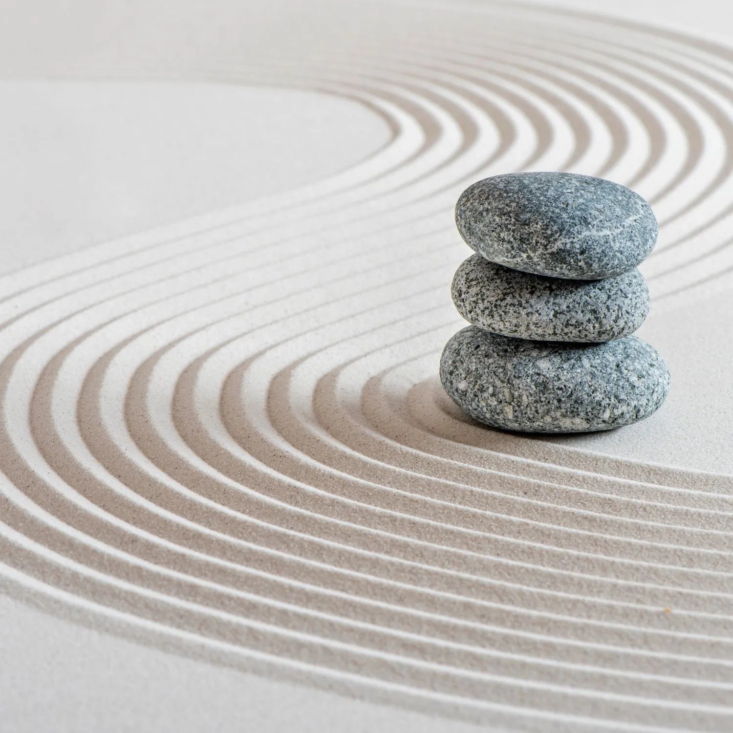 zen stones on sand
