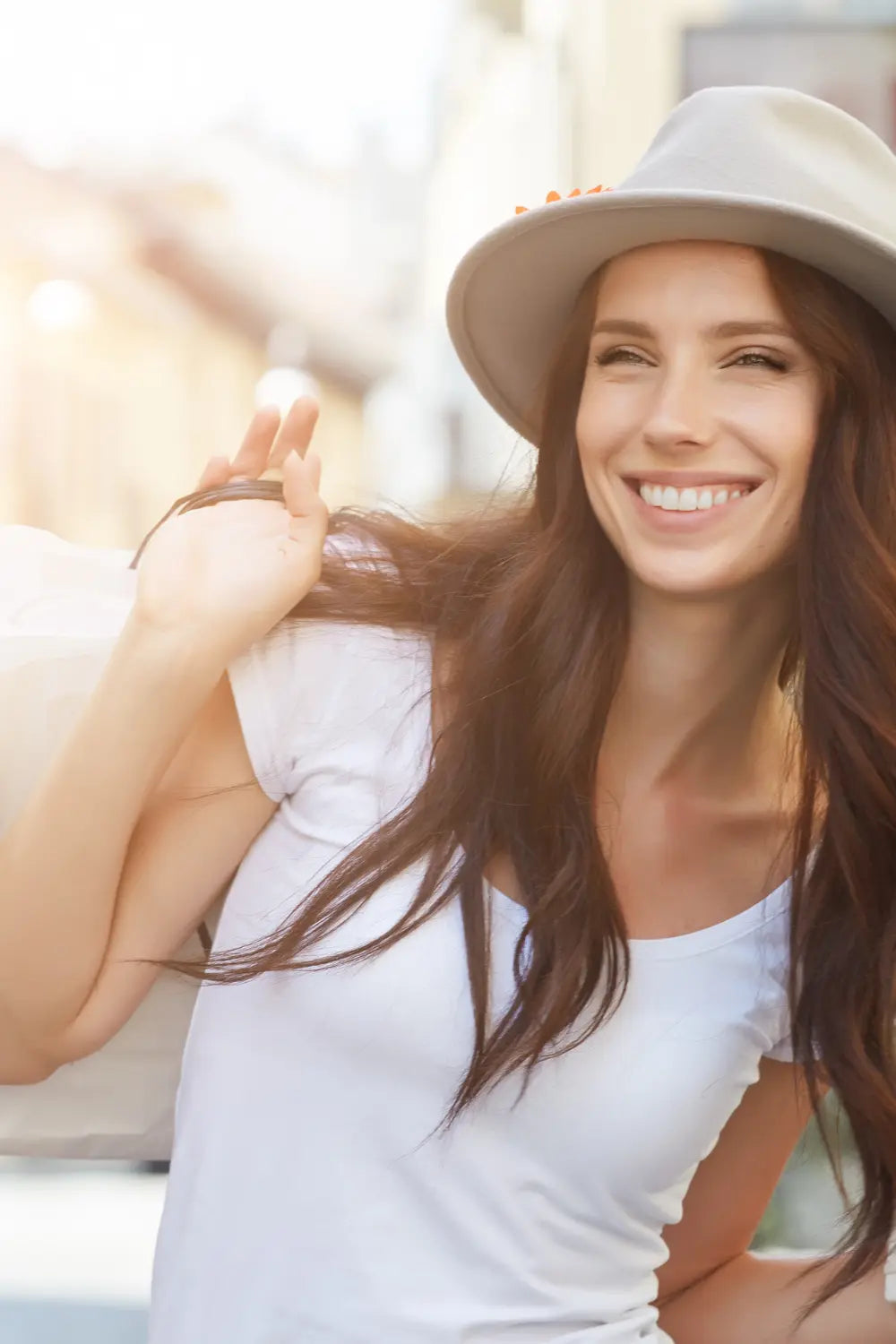 young woman on a tee shirt smiling with confidence